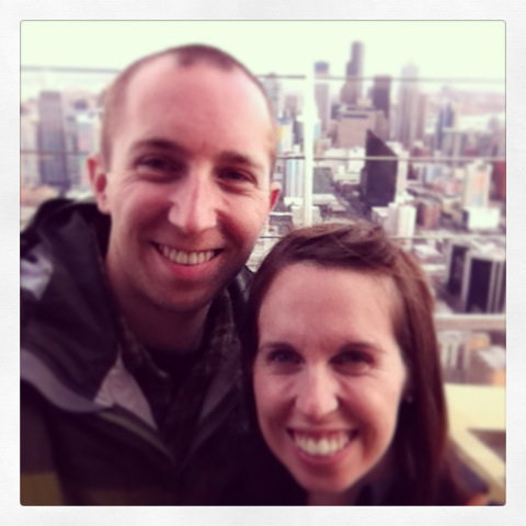 Image of the author and her husband with the Seattle skyline in the background.